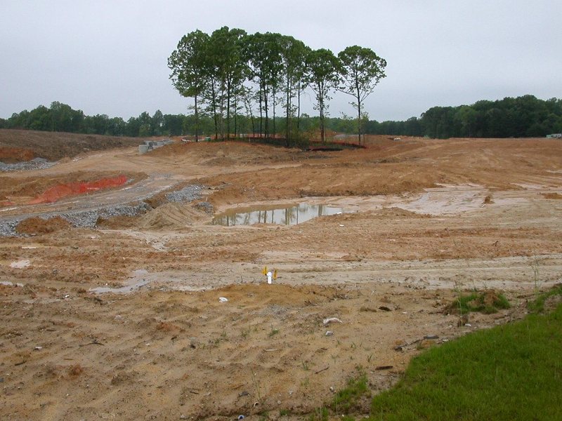 clearing land opposite McCoart Administrative Center, before construction of County Center Crossing